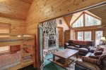 Black Bear Lodge living area with beautiful views and bunk beds . 